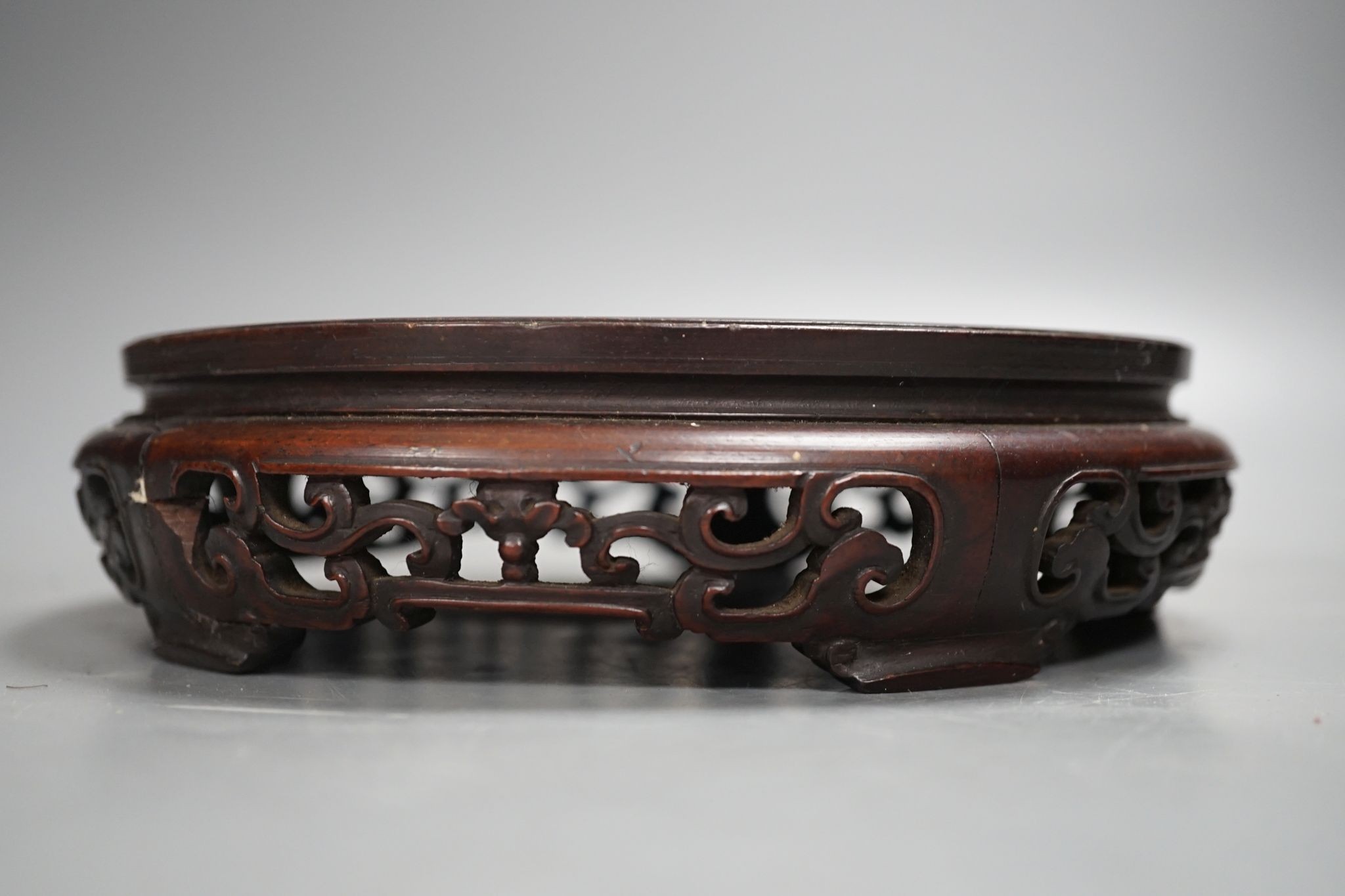 A Chinese carved hardwood stand 19cm